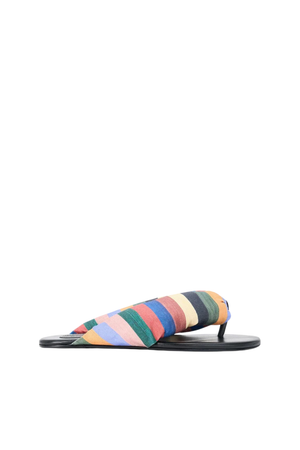 A puffy flip flop with a rainbow striped thong