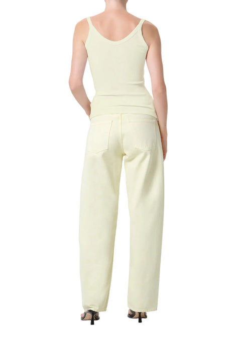 Person wearing a light green tank top and matching mid-rise, wide leg pants on a white background from the back