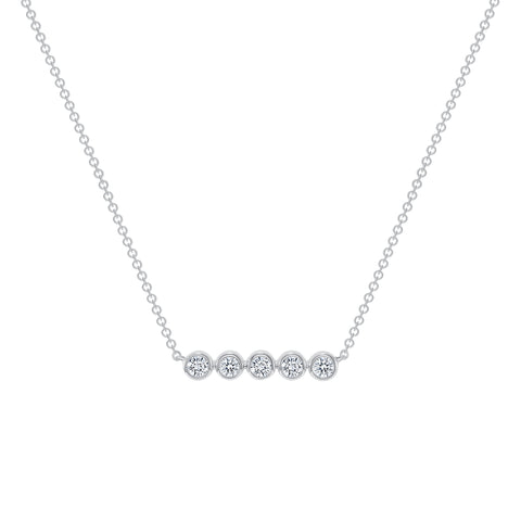 Ghost image of a 14k white gold necklace that features a small bar of 5 round bezel set diamonds on a petite rolo chain. 