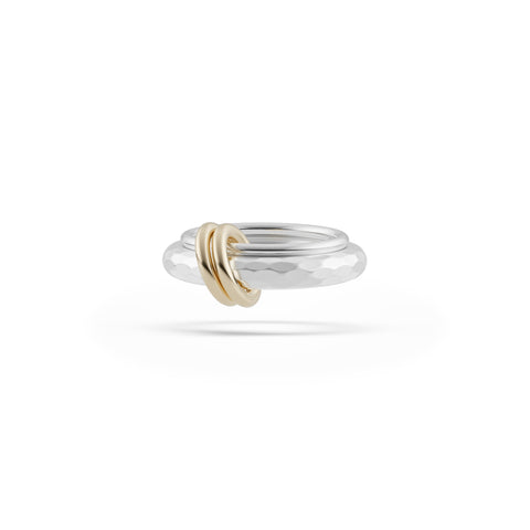Ghost image of a Spinelli Kilcollin Agon ring that features a 1.7mm sterling silver band and a 3.8mm sterling silver textured band connected by two yellow gold connectors. 
