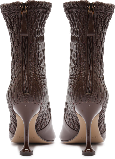 Brown cable knit boots with zipper on a white background