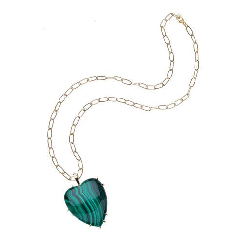 Carved malachite heart pendant on a gold chain. 