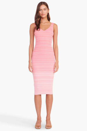 Model facing the camera in the pink ombre stripe midi dress