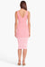Model facing the back in the pink ombre stripe midi dress