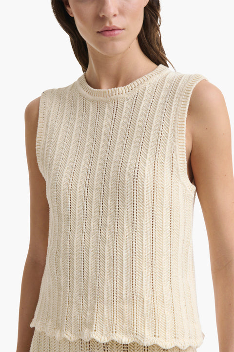 Up close of cotton knitted tank top in cream on woman.
