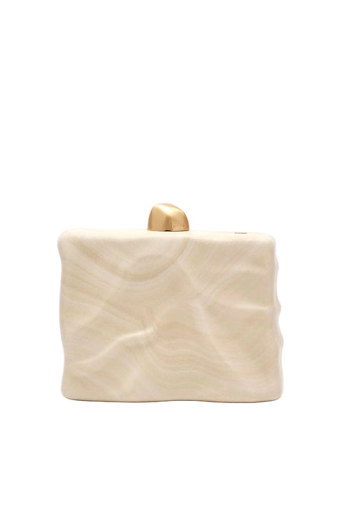 cream wavy clutch with gold knob detail.
