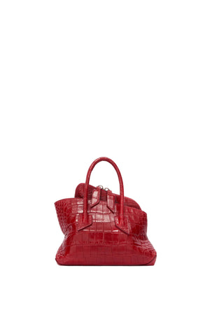 Red croc handbag on a white background