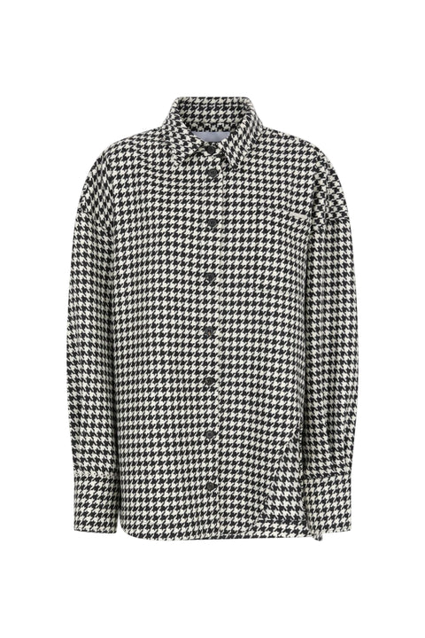 Houndstooth patterned shirt on a light gray background