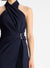 Close up of the navy halter midi dress on a model