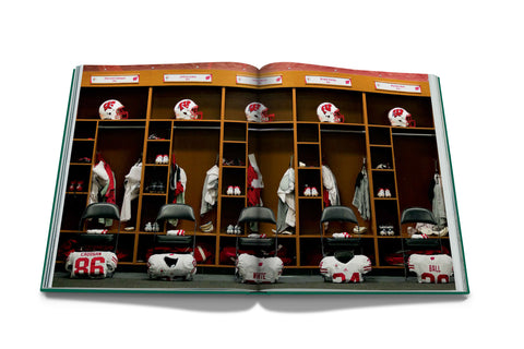 Open book showing a locker room with sports equipment and uniforms.