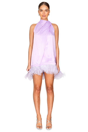Model wearing the halter neck feather hem mini dress in lilac.