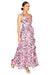 Model walking to the right showing the side of the floral midi dress with ruffles.