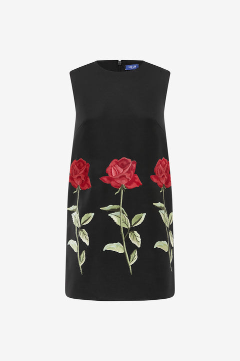 Black sleeveless mini dress with red rose embroidery on a white background