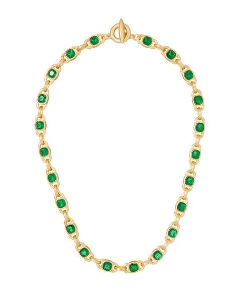 A gold-tone chain necklace that features stationed emeralds throughout.