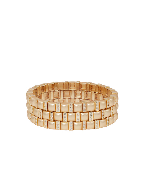 A set of three gold-tone stretch bracelets made of square beads that features alternating skinny pave beads. 