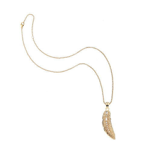 Gold feather pendant with crystals own the middle on a gold chain. 