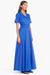 Model turned towards the right in the bright blue belted maxi dress