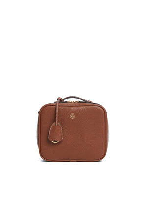 Ghost image of the brown madison mini bag with white contrast stitching.