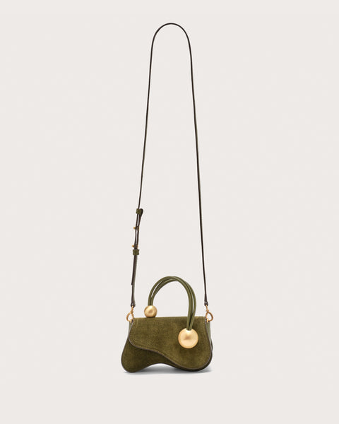 Green suede mini bag with gold-toned hardware, a top handle, and a removable crossbody strap. 