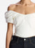 Close up of the white off shoulder crop top on a model