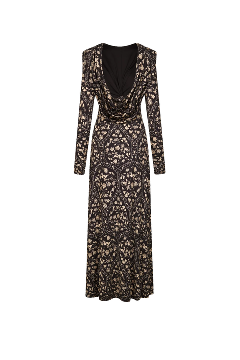 A long-sleeved maxi dress with a black and beige floral lace overlay, featuring a deep V-neckline and a gathered waist detail, shown against a plain white background.