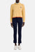 Model facing the camera in the yellow wool sweater with multi pastel trim