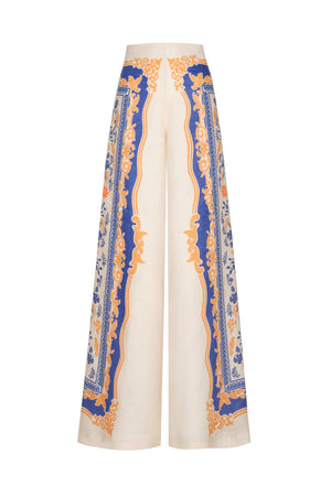 Ghost image of the cream palmirana pants with blue and orange design down the side of the leg.