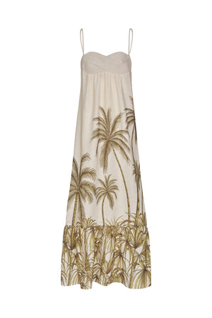 White maxi linen dress decorated with palm tree patterning and a tiered skirt