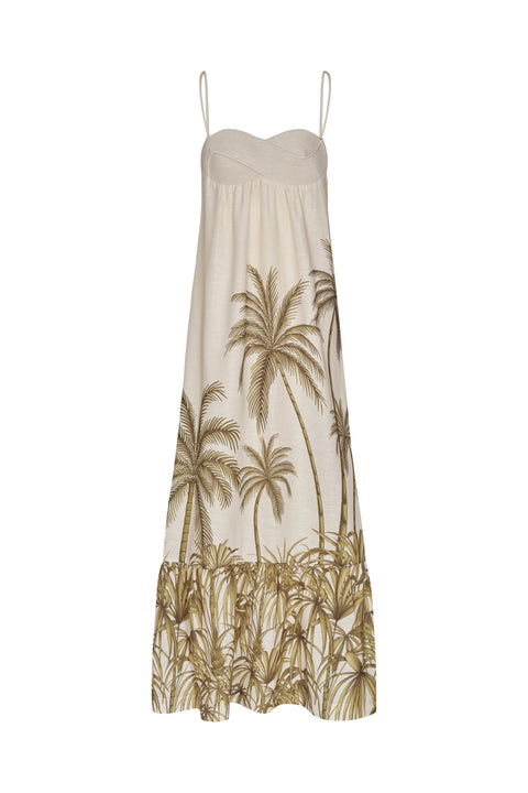 White maxi linen dress decorated with palm tree patterning and a tiered skirt
