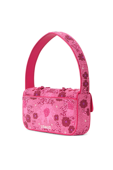 Back view of a too-toned, hot pink beaded shoulder bag that features intricate floral designs and appliques. 