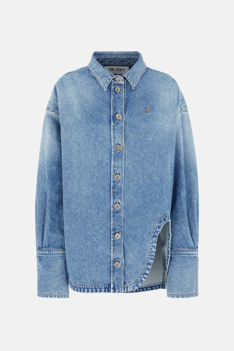 Ghost image of a blue medium wash denim shirt jacket that features a collar, button down, and cuffed sleeves with a curved side split on the front. 