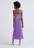Model facing away show the back of the pleated cami dress in lavender.'