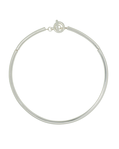 A silver-toned, tubular collar necklace with a toggle clasp. 