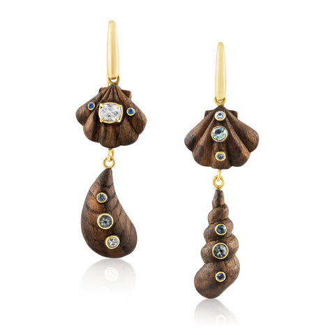 Wooden shell earrings with gold and gemstone accents on a white background