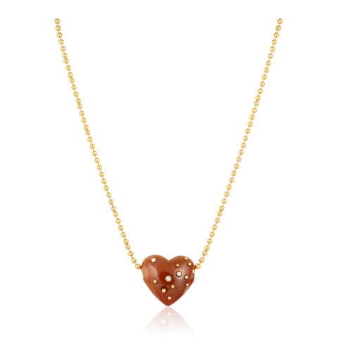 Heart-shaped pendant necklace with gold chain on a white background