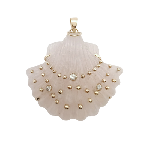 Pink shell pendant with gold studs and white sapphire on a white background