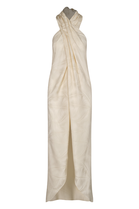 A long halter-neck cream jacquard top with a cross neckline