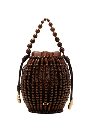 A dark brown wooden bucket bag decorated with vertical rows of round wooden beads, featuring a matching beaded top handle and drawstring ties with gold-toned accents, shown against a plain white background.