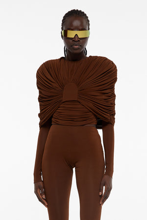 Up close image of model wearing Giuseppe viscose jersey draped top in brown