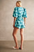Back of the teal and blue romper on a model