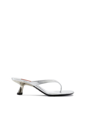 Side view of the silver metallic low heeled thong sandal