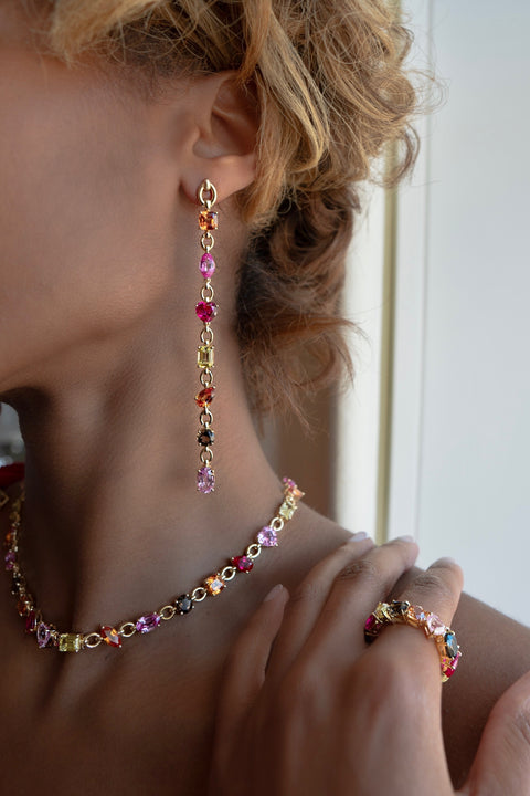 Model wearing the Catena ring with its matching necklace and earring.  